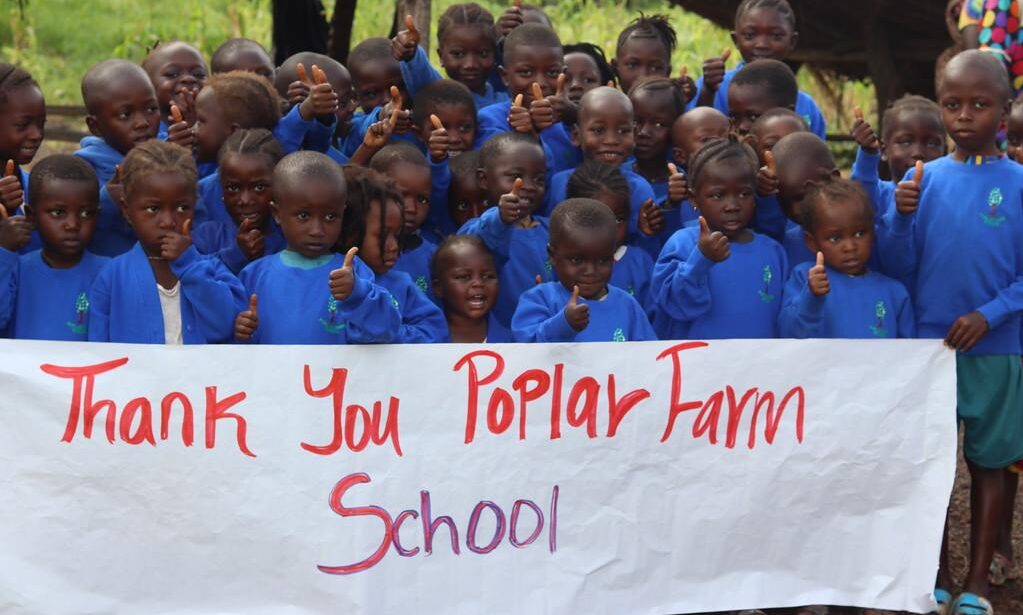 cropped-Africa-Uniform.jpg Children from Freetown wearing their new uniform