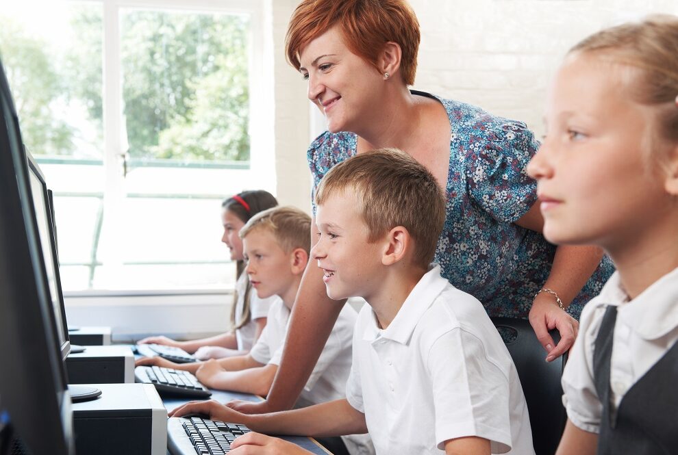 Group,Of,Elementary,Pupils,In,Computer,Class,With,Teacher